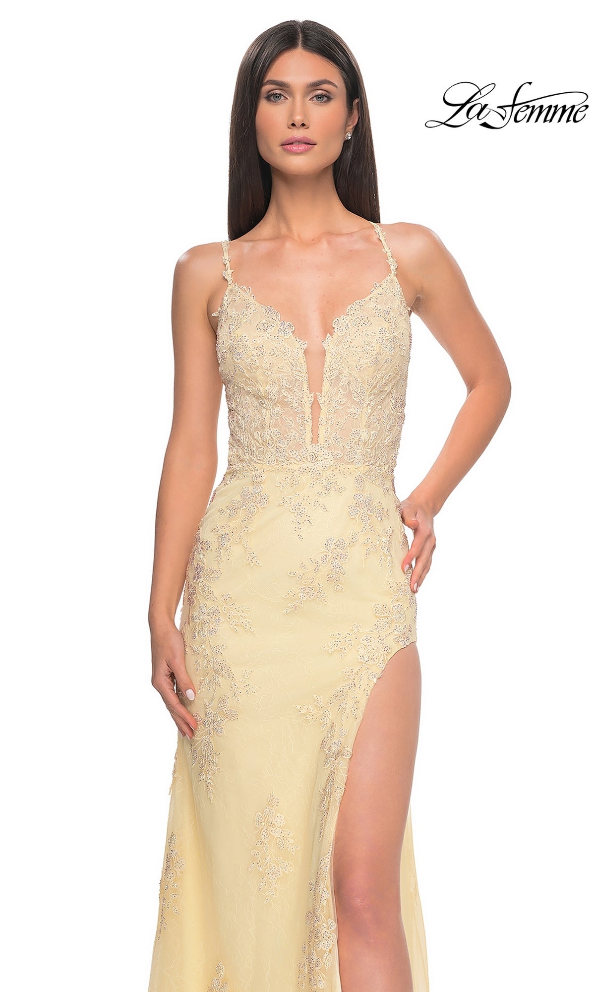 Woman wearing the La Femme Embroidered-Lace Long Prom Dress 32205 in light yellow, featuring a deep V neckline, thin straps, high slit, and floral embroidery. The La Femme logo is displayed in the top right corner.